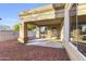 Covered patio with stone flooring and access to backyard at 8383 W Utopia N Rd, Peoria, AZ 85382