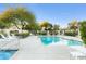 Inviting community pool with plenty of lounge chairs at 8383 W Utopia N Rd, Peoria, AZ 85382