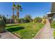 Large backyard with grassy area and walkway at 8435 E Catalina Dr, Scottsdale, AZ 85251