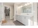 Elegant bathroom with double vanity and large walk-in shower at 8435 E Catalina Dr, Scottsdale, AZ 85251