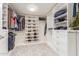 Large walk-in closet with ample shelving and hanging space at 8435 E Catalina Dr, Scottsdale, AZ 85251