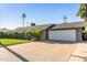 Single story home with a driveway and attached garage at 8435 E Catalina Dr, Scottsdale, AZ 85251