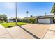 Single story home with a driveway and basketball hoop at 8435 E Catalina Dr, Scottsdale, AZ 85251