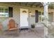 Inviting front porch with wooden chairs and a welcome mat at 8435 E Catalina Dr, Scottsdale, AZ 85251