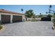 Spacious three-car garage with paver driveway and basketball court at 8601 N 64Th Pl, Paradise Valley, AZ 85253