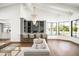 Modern home bar with a marble countertop and stylish bar stools at 8601 N 64Th Pl, Paradise Valley, AZ 85253