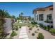 Landscaped backyard with walkway and pergola at 8601 N 64Th Pl, Paradise Valley, AZ 85253