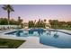 Resort-style pool with cabanas and lush landscaping at 8601 N 64Th Pl, Paradise Valley, AZ 85253