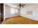 Bright bedroom with carpeted floors and a ceiling fan at 8627 E Dulciana Ave # 43, Mesa, AZ 85208