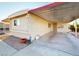 Mobile home with carport and desert landscaping at 8627 E Dulciana Ave # 43, Mesa, AZ 85208