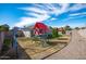 Backyard with grassy area and a colorful playset at 8828 E Des Moines St, Mesa, AZ 85207