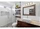 Modern bathroom with a walk-in shower and floating vanity at 8828 E Des Moines St, Mesa, AZ 85207