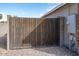 Wooden gate providing backyard access at 8828 E Des Moines St, Mesa, AZ 85207