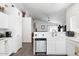 Kitchen with stainless steel dishwasher and view to living area at 8828 E Des Moines St, Mesa, AZ 85207