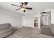 Second bedroom with two sofas, ceiling fan and view into bathroom at 9420 S 35Th Gln, Laveen, AZ 85339