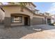 Two-story house with a brown garage door and small front yard at 9420 S 35Th Gln, Laveen, AZ 85339