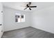 Spacious bedroom with grey flooring and a window at 948 S Alma School Rd Rd # 89, Mesa, AZ 85210