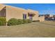 Tan stucco house with a tiled entryway, walkway, and landscaping at 948 S Alma School Rd Rd # 89, Mesa, AZ 85210