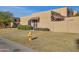 Tan stucco house with a tiled entryway, fire hydrant, and grassy area at 948 S Alma School Rd Rd # 89, Mesa, AZ 85210