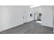 Bright living room with gray vinyl flooring and white walls at 948 S Alma School Rd Rd # 89, Mesa, AZ 85210