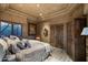 Spacious bedroom with a king-size bed and wooden wardrobe at 9839 E Madera E Dr, Scottsdale, AZ 85262