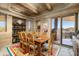 Rustic southwestern dining room with wood table and chairs, and access to a patio at 9839 E Madera E Dr, Scottsdale, AZ 85262