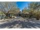 Beautiful desert contemporary home with mature trees and a brick driveway at 9839 E Madera E Dr, Scottsdale, AZ 85262