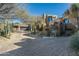 Luxury home with a large, inviting entryway and mature desert landscaping at 9839 E Madera E Dr, Scottsdale, AZ 85262