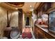 Long hallway with a rustic feel and patterned rug at 9839 E Madera E Dr, Scottsdale, AZ 85262