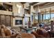 Living room with stone fireplace, mountain views and southwestern decor at 9839 E Madera E Dr, Scottsdale, AZ 85262