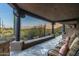 Covered patio with seating and stunning desert views at 9839 E Madera E Dr, Scottsdale, AZ 85262