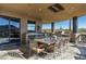 Outdoor dining area with a large table and chairs, plus mountain views at 9839 E Madera E Dr, Scottsdale, AZ 85262