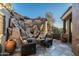 Stone patio with seating area and mountain backdrop at 9839 E Madera E Dr, Scottsdale, AZ 85262