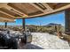 Spacious flagstone patio with comfortable seating, a fireplace, and mountain views at 9839 E Madera E Dr, Scottsdale, AZ 85262