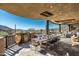 Covered patio with dining and seating areas, and mountain views at 9839 E Madera E Dr, Scottsdale, AZ 85262