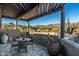 Covered patio with table and chairs, offering scenic views at 9839 E Madera E Dr, Scottsdale, AZ 85262