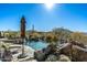 Relaxing pool area with mountain views and stone accents at 9839 E Madera E Dr, Scottsdale, AZ 85262