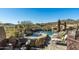 Relaxing pool and spa area with mountain views and comfortable lounge chairs at 9839 E Madera E Dr, Scottsdale, AZ 85262