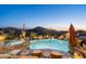 Luxury pool and spa with lounge chairs, mountain backdrop at 9839 E Madera E Dr, Scottsdale, AZ 85262