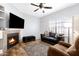 Bright living room with fireplace, hardwood floors and comfortable seating at 1126 W Elliot Rd # 1017, Chandler, AZ 85224