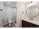 Modern bathroom with marble-look shower and vanity at 11380 N 113Th Dr, Youngtown, AZ 85363