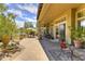 Spacious backyard with patio, seating area, and mature trees at 12617 W Mine Trl, Peoria, AZ 85383
