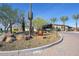 Community entrance with landscaping and signage at 12617 W Mine Trl, Peoria, AZ 85383