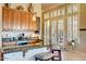 A well-lit kitchen area featuring granite countertops, bar seating, and ample natural light from nearby windows at 12617 W Mine Trl, Peoria, AZ 85383