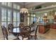 Breakfast nook with wood table and chairs, plus kitchen island at 12617 W Mine Trl, Peoria, AZ 85383
