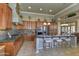 Kitchen with double ovens, granite countertops, and island at 12617 W Mine Trl, Peoria, AZ 85383