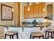 Kitchen area features a granite-topped bar with seating, stylish decor, and functional cooking space at 12617 W Mine Trl, Peoria, AZ 85383