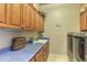 Bright laundry room with washer, dryer, and ample cabinetry at 12617 W Mine Trl, Peoria, AZ 85383