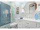 Elegant bathroom with a herringbone tile shower and white vanity at 14216 E Desert Cove Ave, Scottsdale, AZ 85259