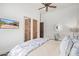 Relaxing bedroom with a light wood bed frame and en-suite bathroom at 14216 E Desert Cove Ave, Scottsdale, AZ 85259